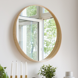 Miroir Wild d'un diamètre de 68 cm et son cadre en bois doré.